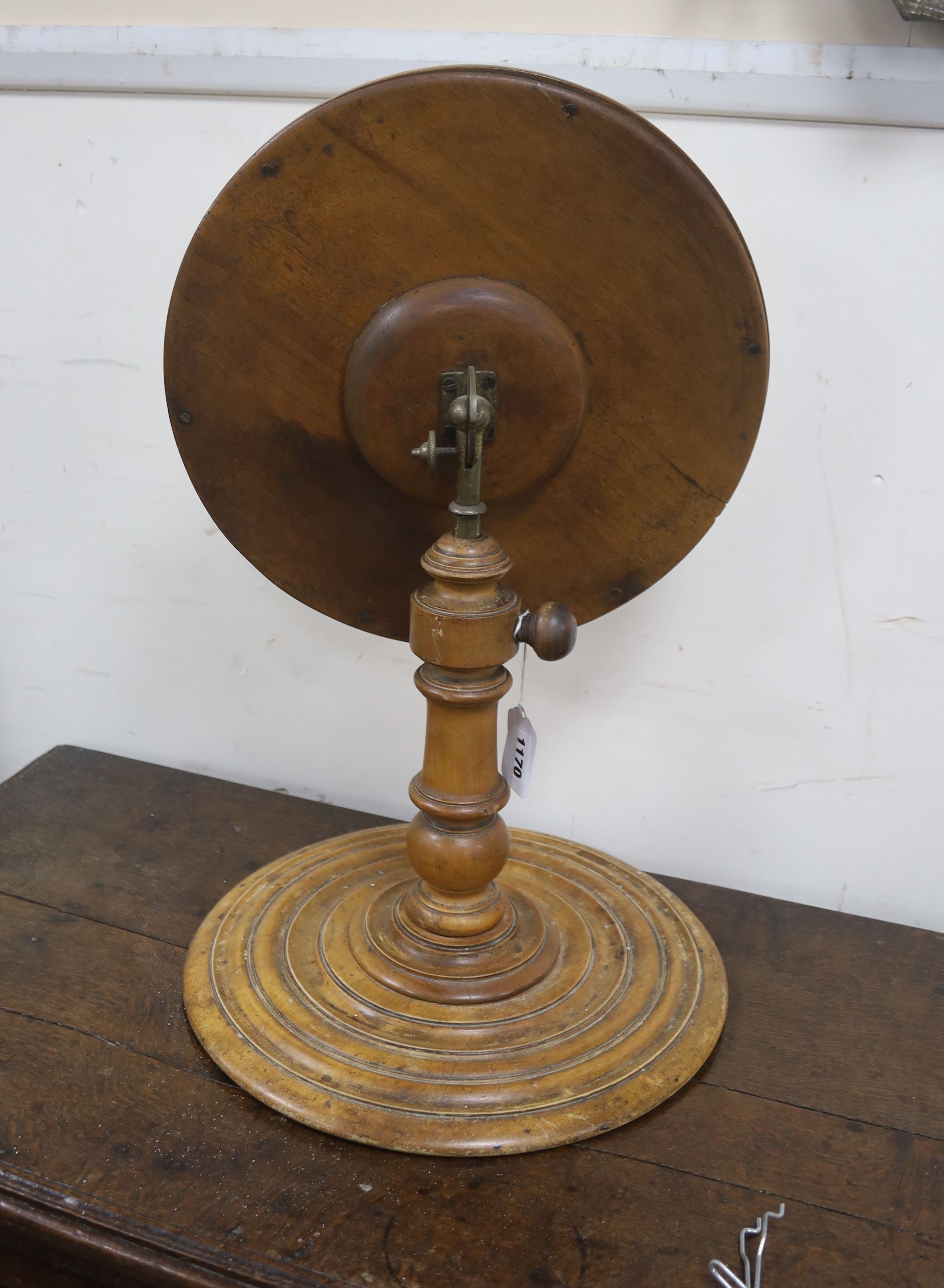 A Victorian gentleman’s telescopic walnut shaving mirror, with a stepped circular base, plate diameter 34cm, height 56cm